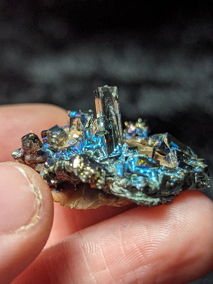 EsotericMineralsnCrystals Bismuth Crystal on River Rock